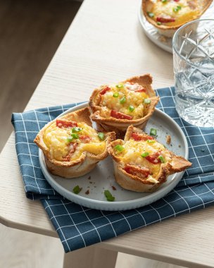 Baked egg, ham and toast cup for breakfast brunch.