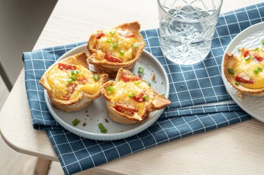 Baked egg, ham and toast cup for breakfast brunch.