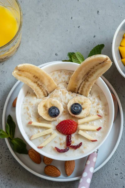 Oatmeal porridge with bunny, chick and flower for Easter — Stock Photo, Image