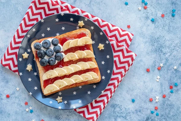 American flag toast with banana, strawberry jam and blueberry