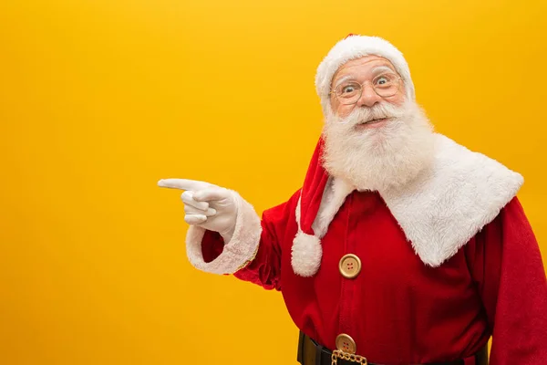 Santa Claus Pulling Huge Bag Gifts Yellow Background Copy Space — Stock Photo, Image
