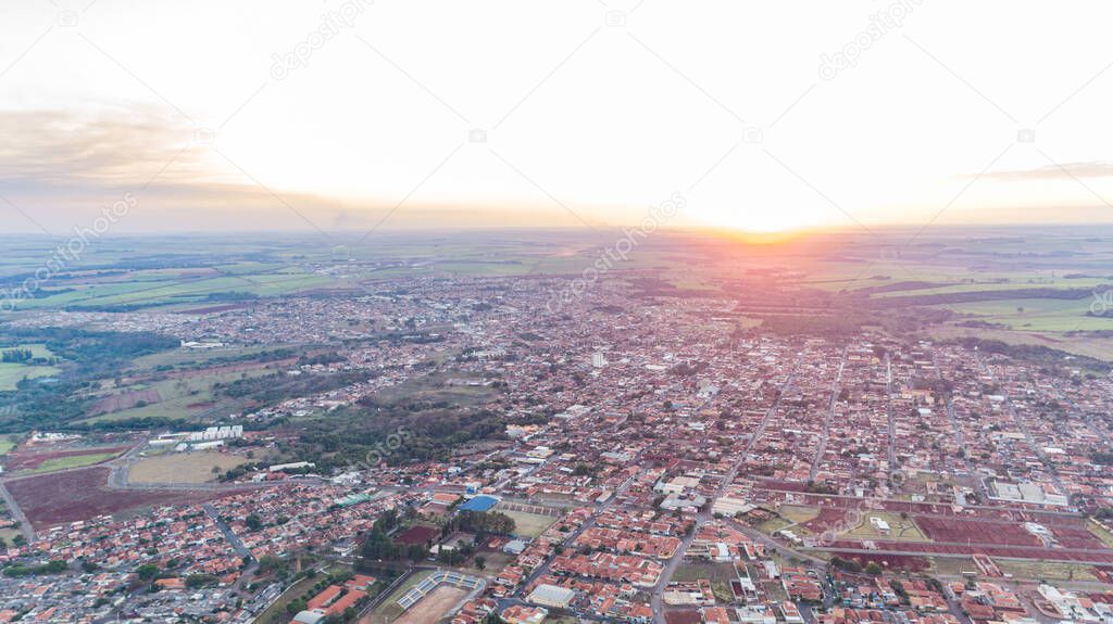 Jardinopolis, Sao Paulo / Brazil - Circa August 2019: Aerial image of Jardinopolis during sunset.