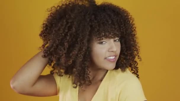 Young Brazil Curly Woman Gesturing Posing Yellow Background — Stock Video