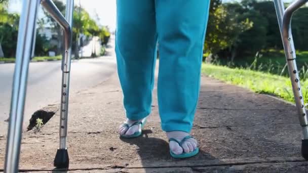Close View Old Weak Woman Walking Outdoors Using Walkers — Stock Video