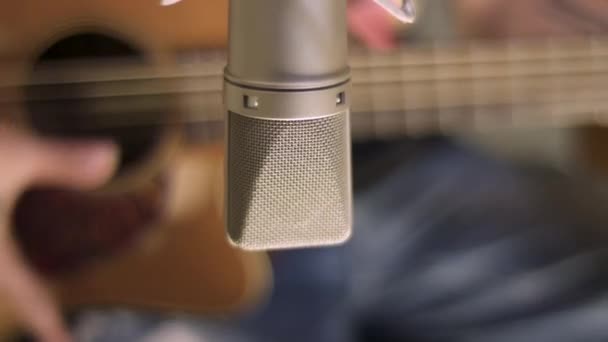 Close View Microphone Blurred Man Playing Guitar — Stock Video