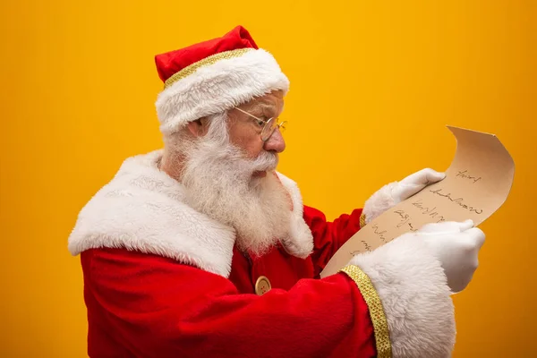 Happy Santa Claus Holding Vintage Paper Yellow Background Merry Christmas — Stock Photo, Image