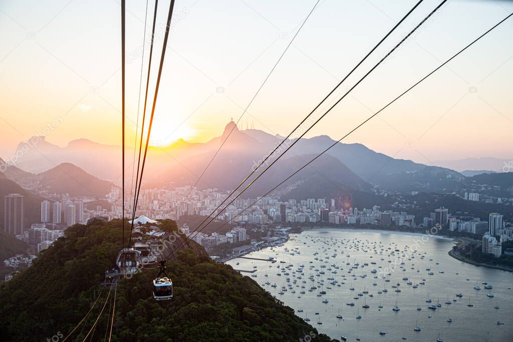 Rio de Janeiro, Rio de Janeiro / Brazil - Circa October 2019: Cable car at Sugar Loaf Mountain, view of Rio cityscape and Sugarloaf Cable Car.
