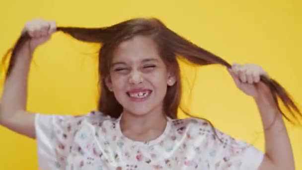 Cute Caucasian Girl Long Hair Posing Gesturing Yellow Background — Stock Video