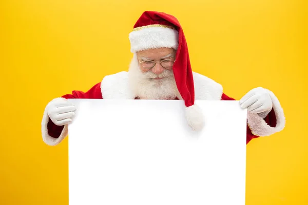 Happy Santa Claus Looking Out Blank Sign Isolated Yellow Background — Stock Photo, Image