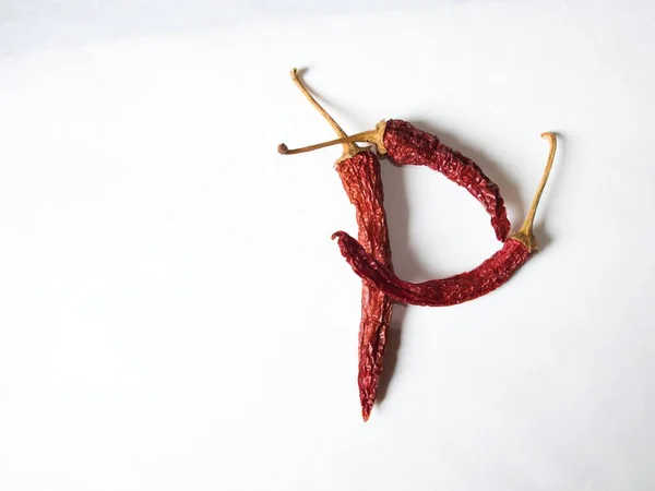 Buchstabe Mit Roter Paprika Auf Weißem Hintergrund Symbol Form Des — Stockfoto