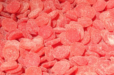 Arka plan olarak pembe marmelat yığını. Şekere yakın çekim.