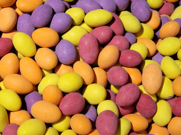 A pile of colorful sweets as a background. Candy close-up.