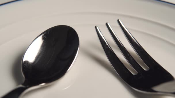 Fork Rises White Plate Spoon Blue Stripe Edge Close Macro — 图库视频影像