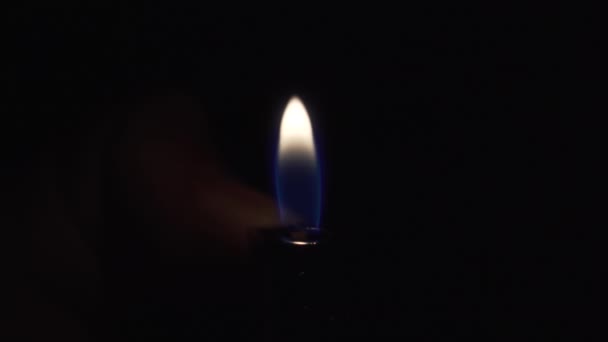 Man Hand Turns Piezoelectric Gas Lighter Dark Bright Blue Yellow — Stock Video