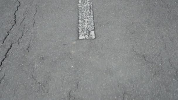Shabby White Arrow Cracked Old Gray Asphalt Road Marking Direction — Stock Video