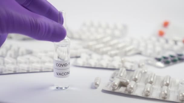 Coronavirus Vaccine Hand Protective Surgical Gloves Picks Glass Ampoule Medicine — Stock Video