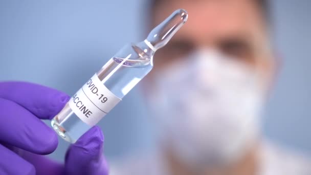 Coronavirus Vaccine Biologist Protective Gloves Face Mask Holds His Hand — Stock Video