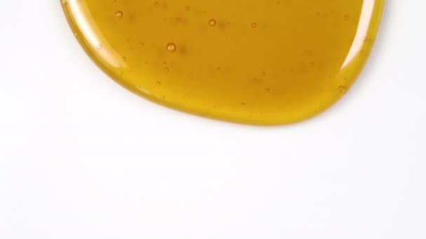 Golden Bee Honey Flows White Background Small Bubbles Close Uniform — Stock Video