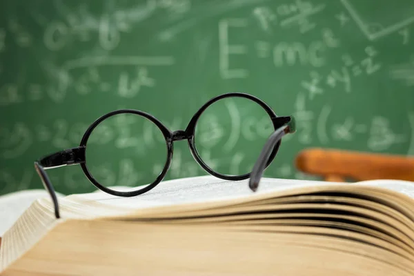 Glasses on open book — Stock Photo, Image