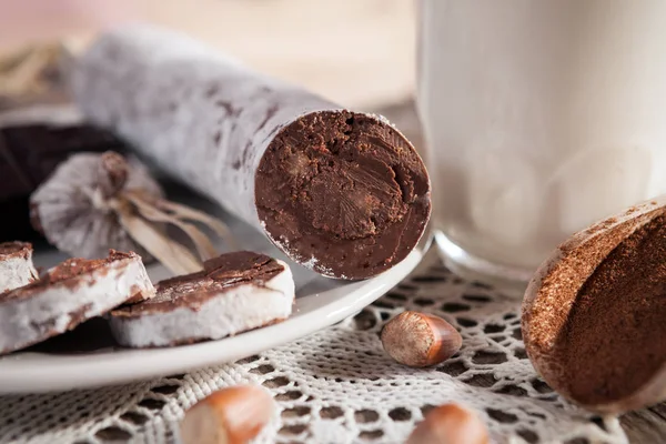 Front side of chocolate sausage on the plate