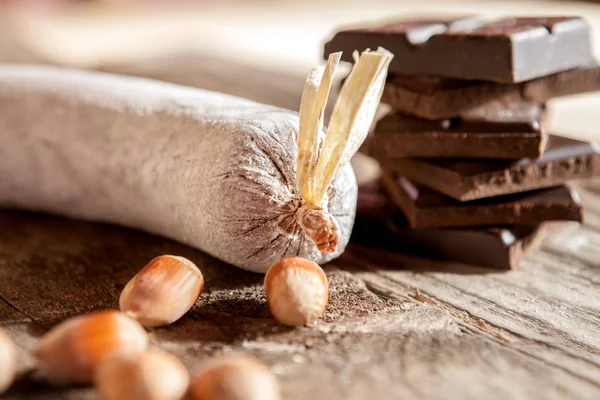 Close shot of chocolate sausage with hazelnuts — Stock Photo, Image
