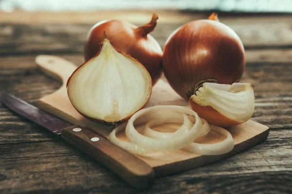 Onion cuts on chopping board