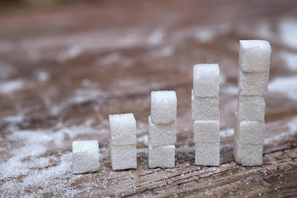 Stacks of white sugar cubes  diabetes and high blood sugar — Stock Photo, Image