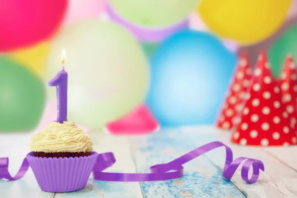 Vela de cumpleaños con número 1 en cupcake — Foto de Stock