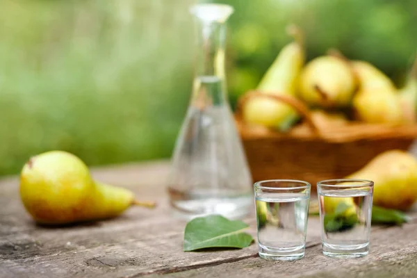 Two shot glass with pear liqueur drink — Stock Photo, Image