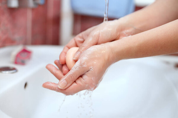 Washing of hands with soap
