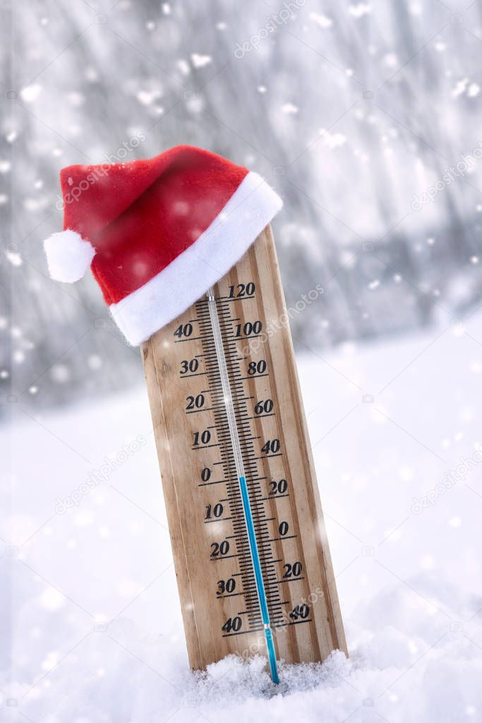 winter weather with a cute thermometer  in Santa Claus hat