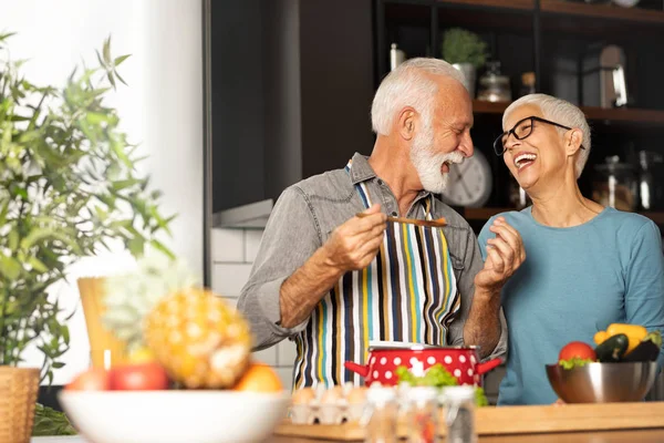 Happy and love grandparents couple prepare food