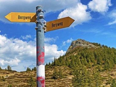 Mountaineering signposts and markings on peaks and slopes of the Pilatus mountain range and in the Emmental Alps, Alpnach - Canton of Obwalden, Switzerland (Kanton Obwalden, Schweiz) clipart