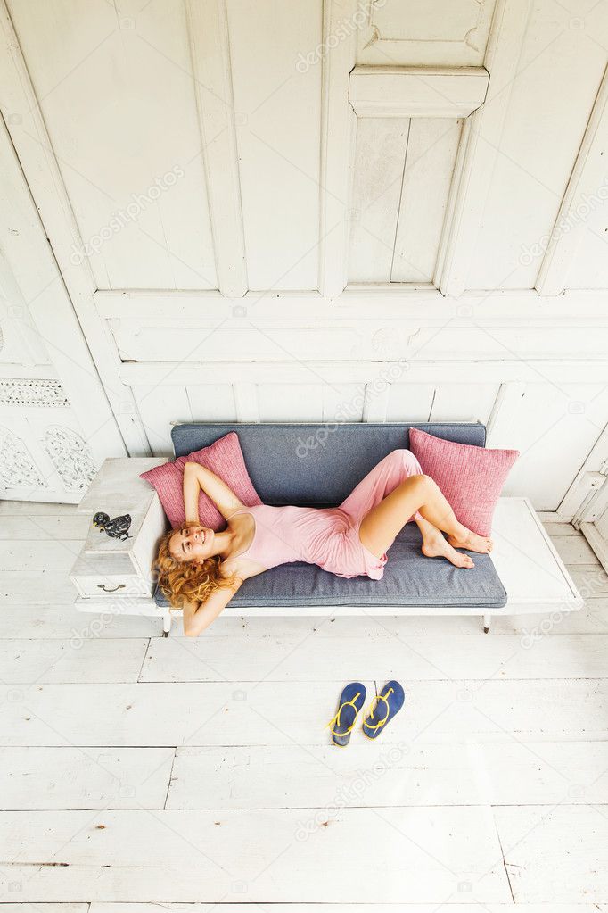 young girl relaxing on couch