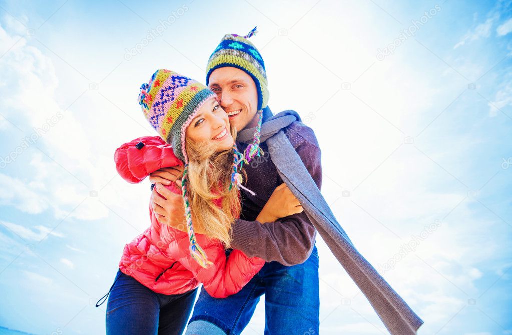 Couple hugging in winter day 