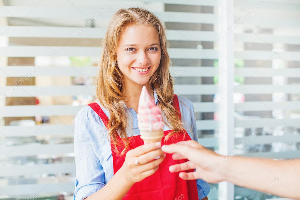 Ice cream seller in shop — Stock Photo © apid 128071736