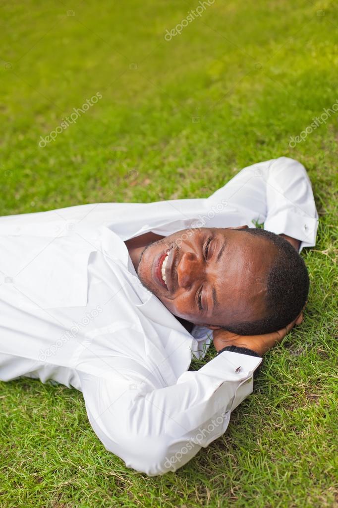 happy african man on grass