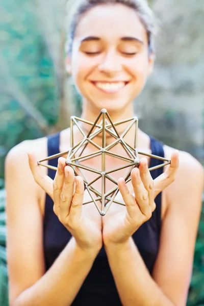 Woman meditating on sacred geometry — Stock Photo, Image