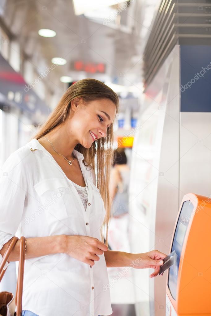 Woman tapping access card for transport