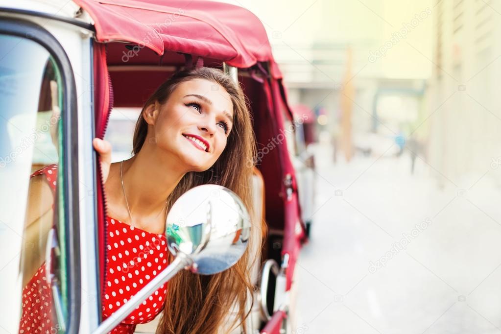 woman enjoying tuk-tuk ride 