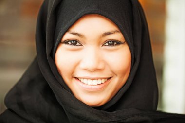  woman wearing kohl and hijab clipart