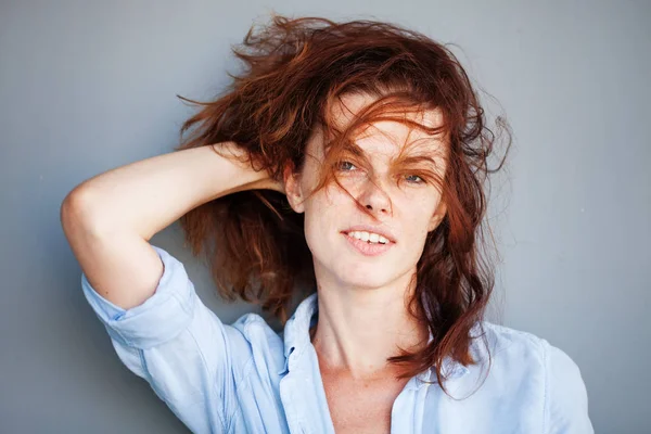 Woman playing with her hair — Stock Photo, Image