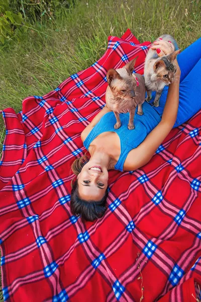 Woman playing with dogs — Stock Photo, Image