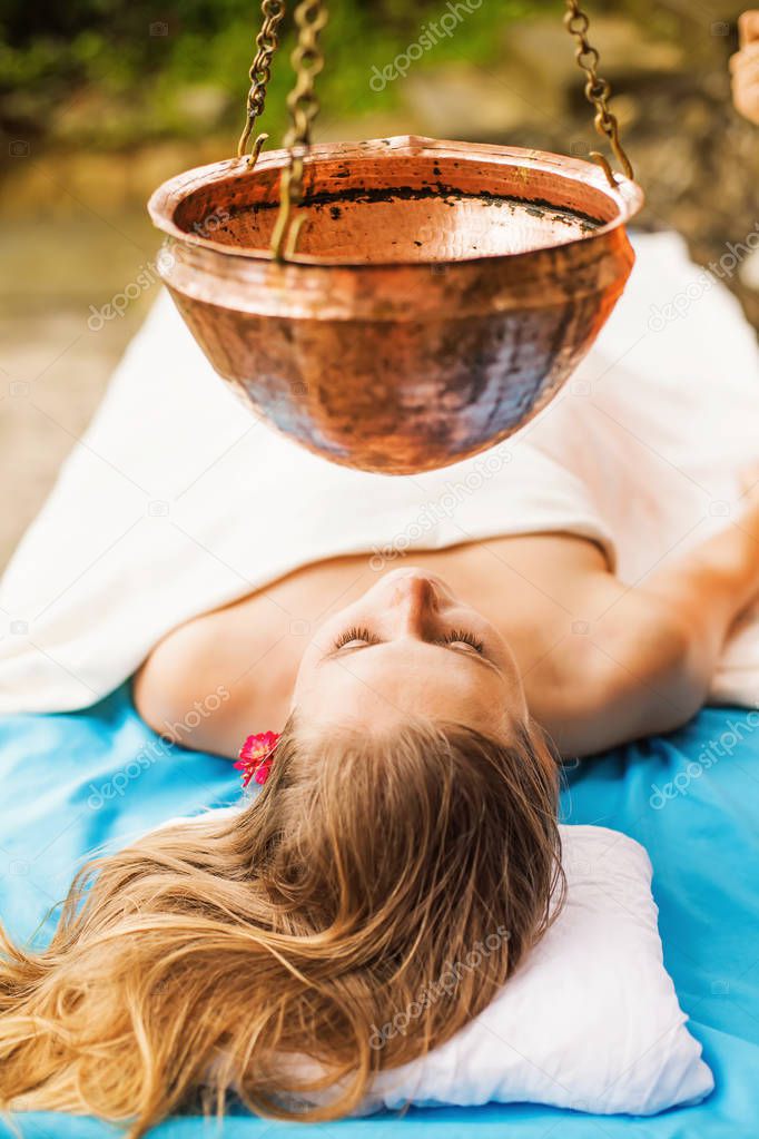 woman getting ayurvedic treatment