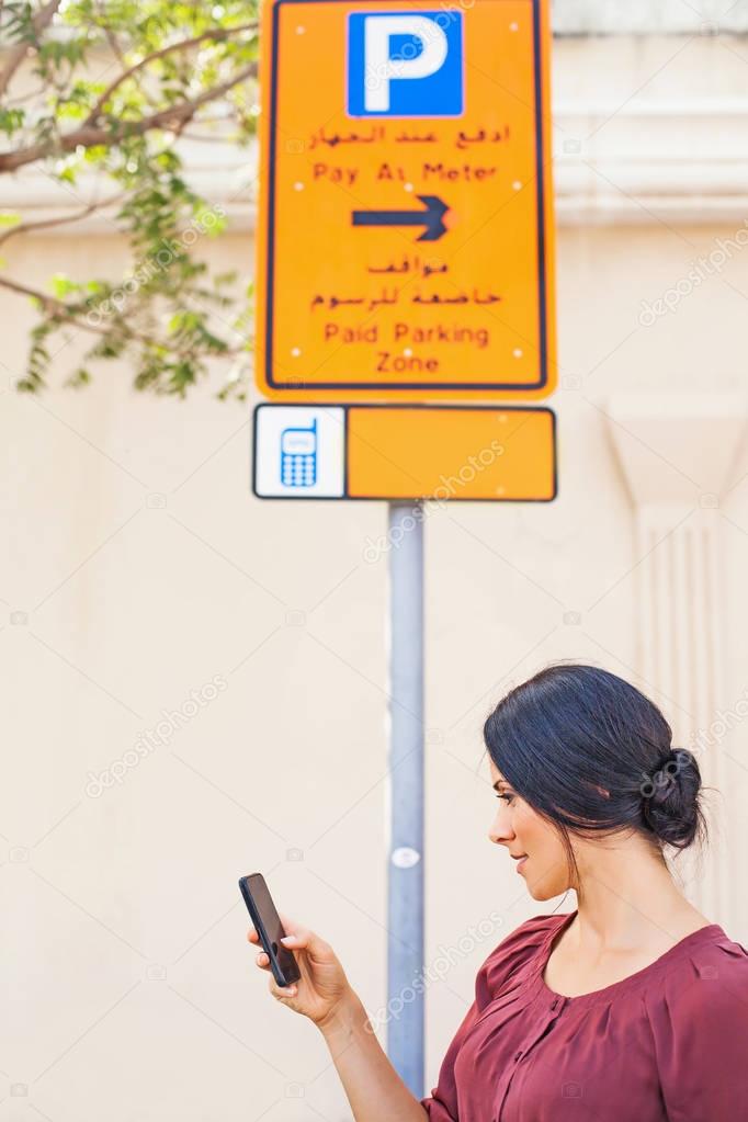 woman walking with  phone 