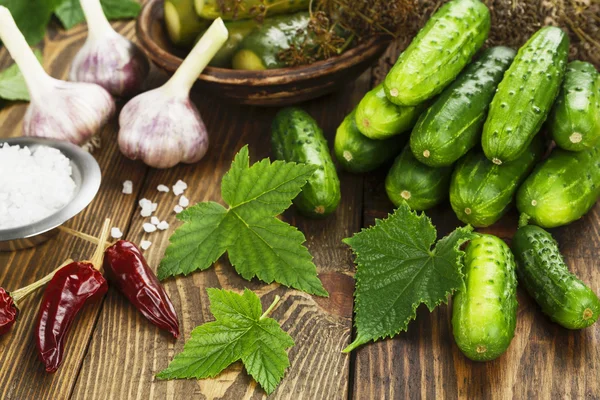 Fresh and pickled cucumbers — Stock Photo, Image