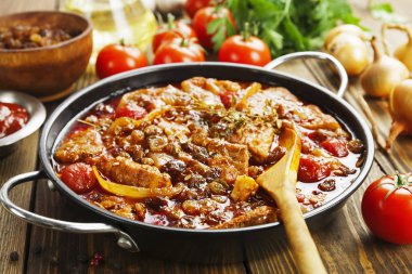 Pork stew with tomatoes and raisins  clipart