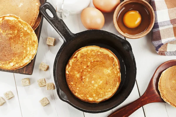 Homemade pancake in the frying pan on the table — Stock Photo, Image