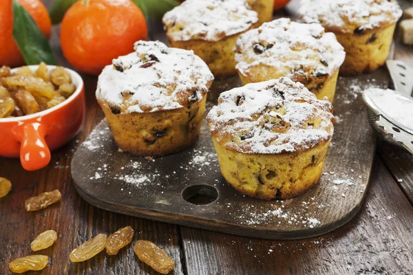 Mandarin muffins with raisins on the table — Stock Photo, Image