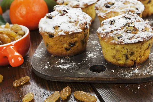 Mandarin muffins with raisins on the table — Stock Photo, Image